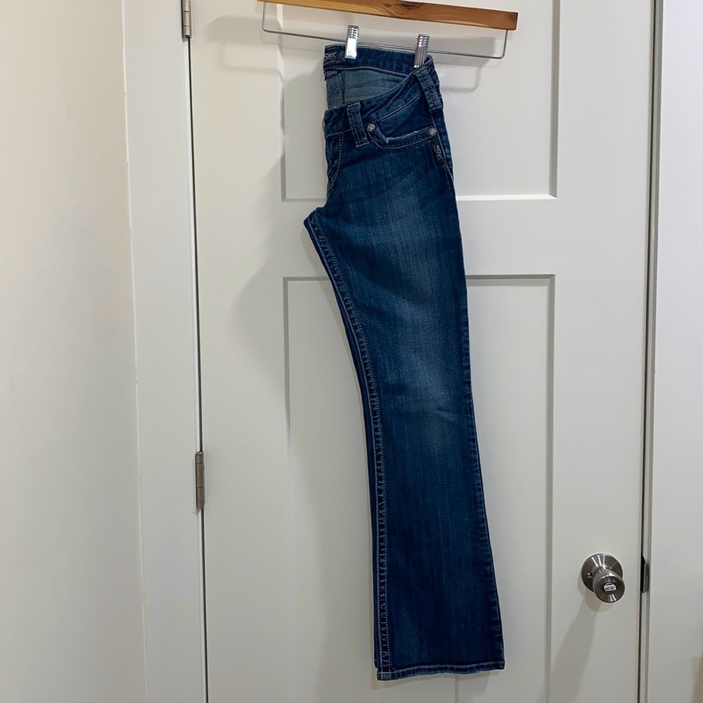 Silver jeans.